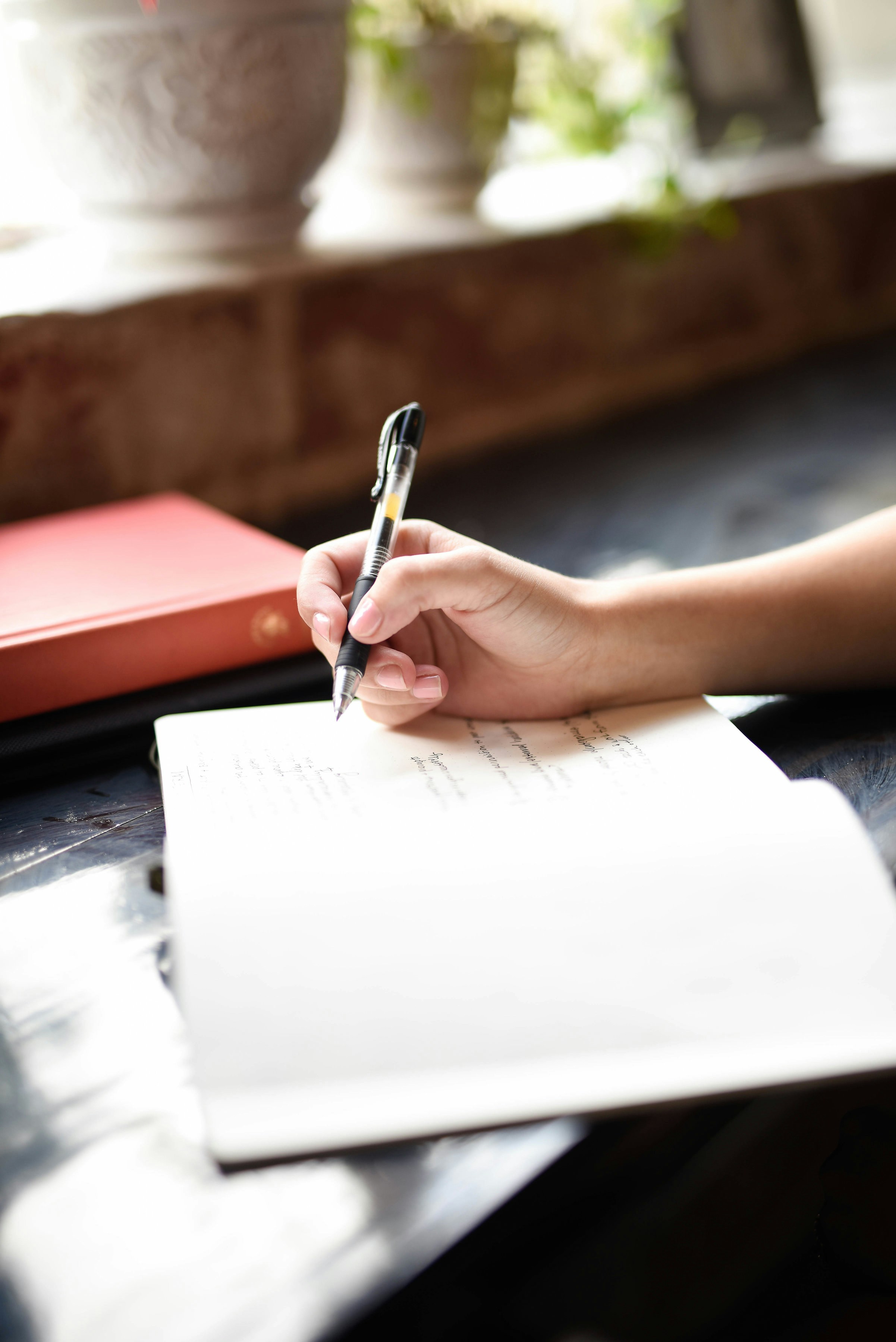 Free printable pregnancy journal pages on a wooden table with dried flowers